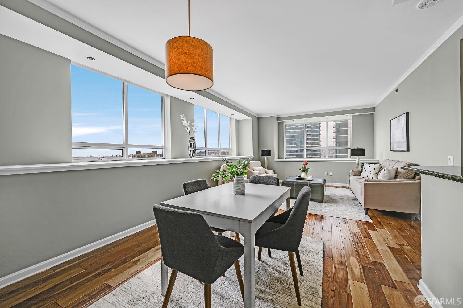 400 Beale Street, Unit 2006 San Francisco, CA 94105 - Photo 11 of 40 a view of a dining room with furniture window and wooden floor