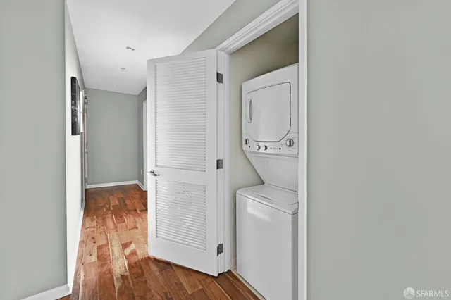a view of hallway with wooden floor