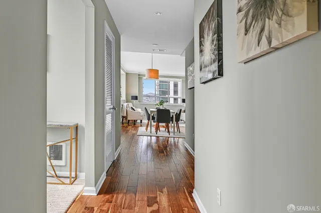 a view of a living room with a wooden floor
