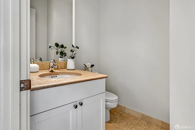 a view of bathroom with a sink and toilet