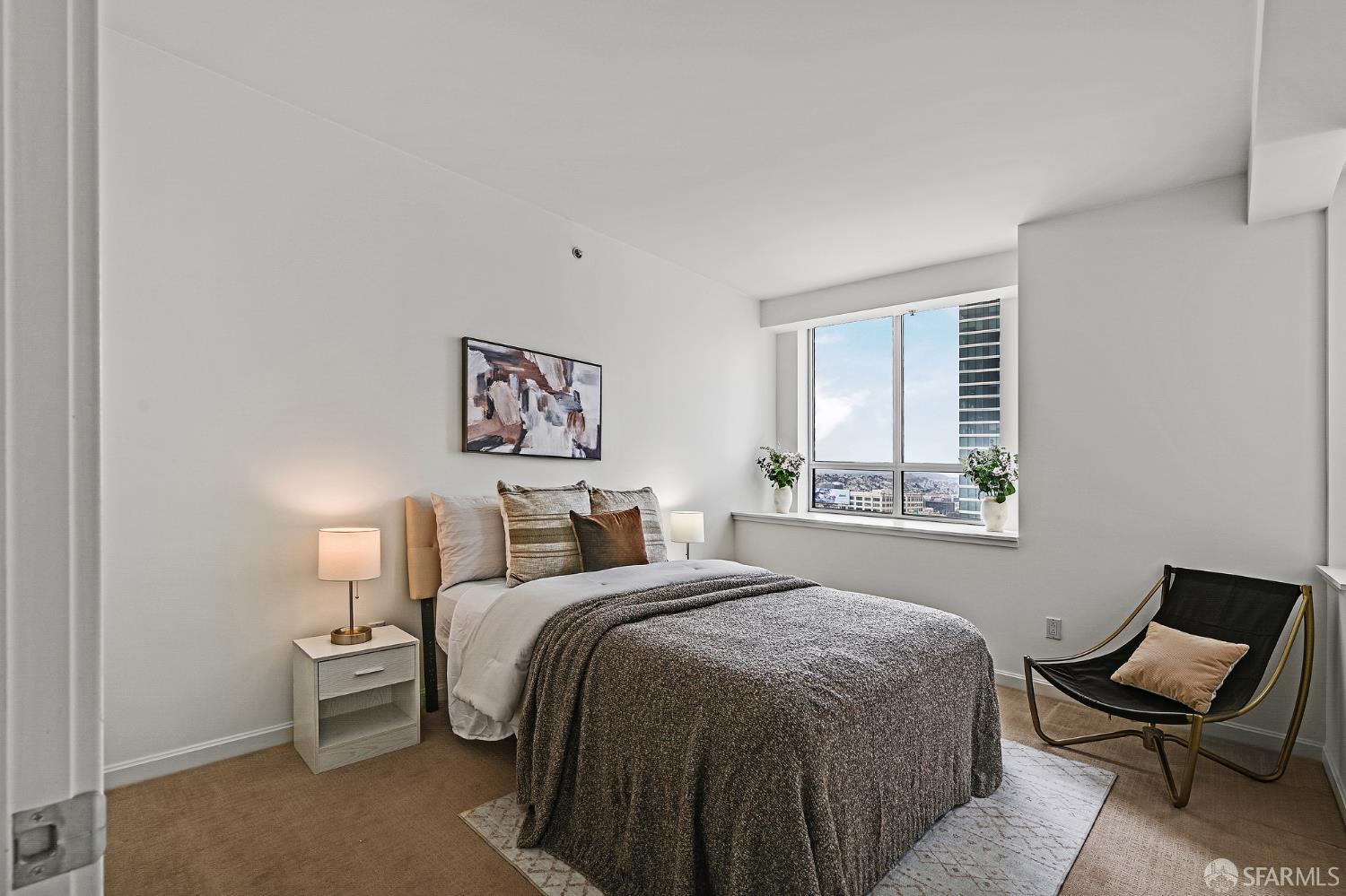 400 Beale Street, Unit 2006 San Francisco, CA 94105 - Photo 21 of 40 a bed room with a bed and chair