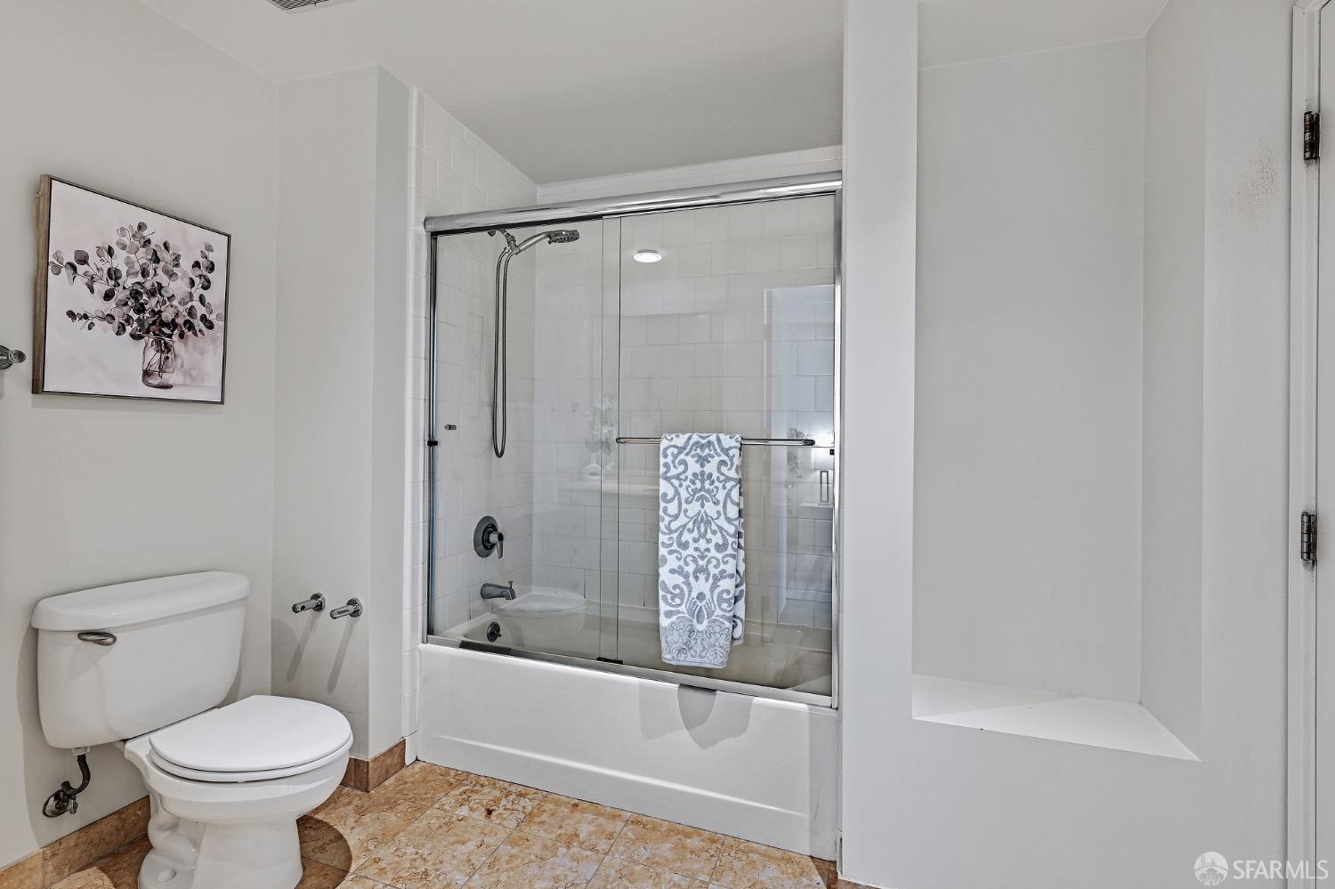 400 Beale Street, Unit 2006 San Francisco, CA 94105 - Photo 23 of 40 a bathroom with a shower and a toilet