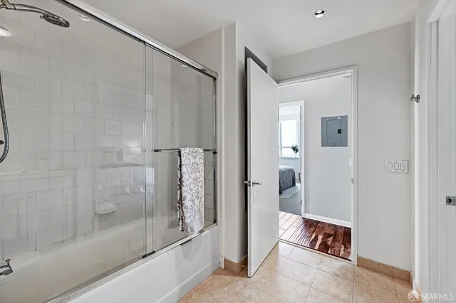 a bathroom with a shower and a bathtub