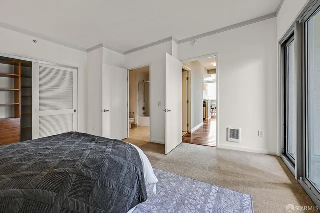 a bedroom with a bed and closet