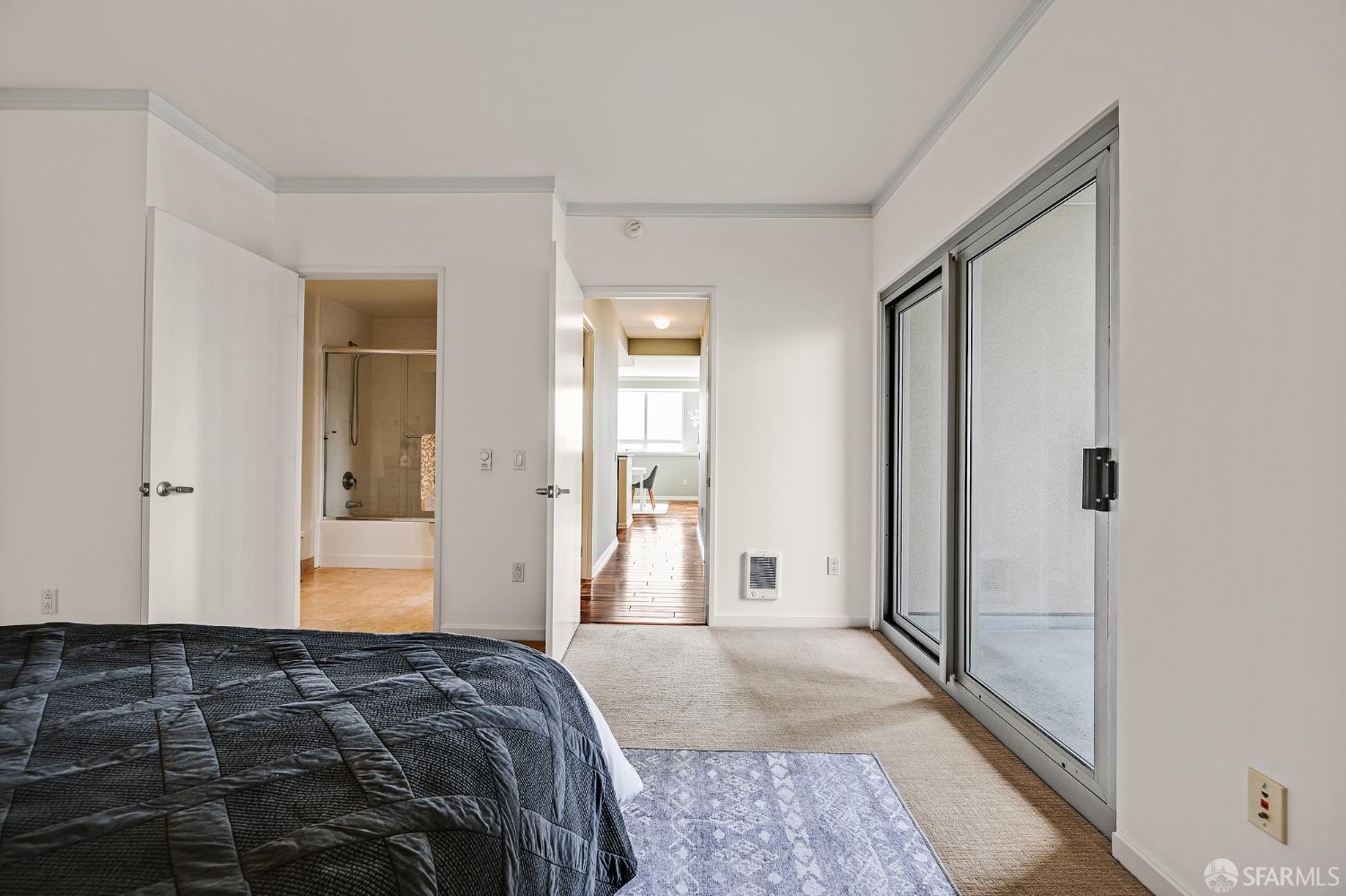 400 Beale Street, Unit 2006 San Francisco, CA 94105 - Photo 31 of 40 a bedroom with a bed and a mirror