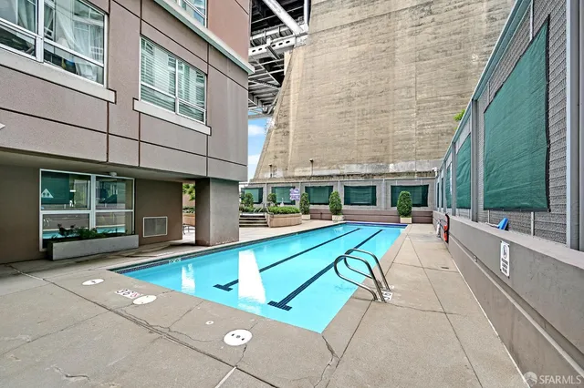 a view of a swimming pool with a lounge chairs