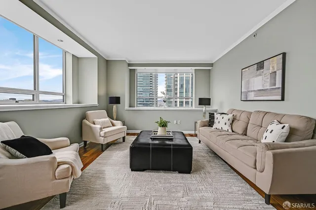 a living room with furniture and a large window