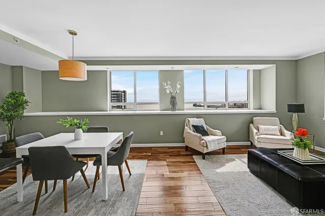 a room with a table chairs and a couch