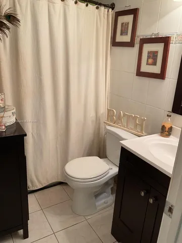 a bathroom with a sink toilet and vanity