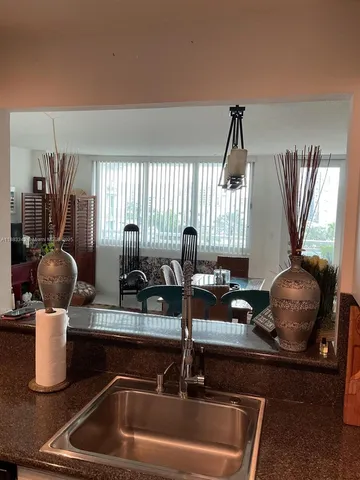 a kitchen with a sink and a stove