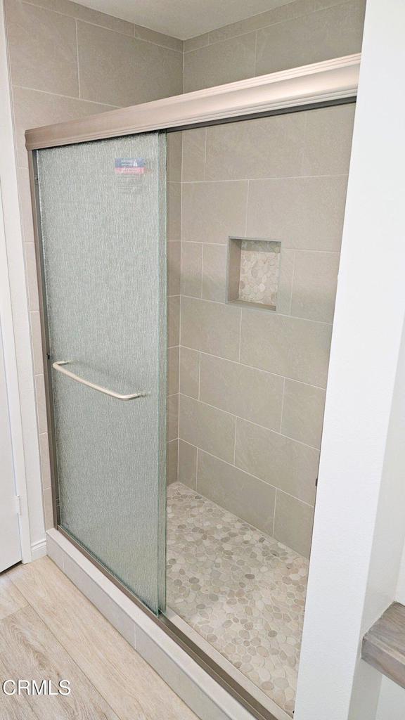 1161 Windward Way Oxnard, CA 93035 - Photo 13 of 19 a bathroom with a glass shower door