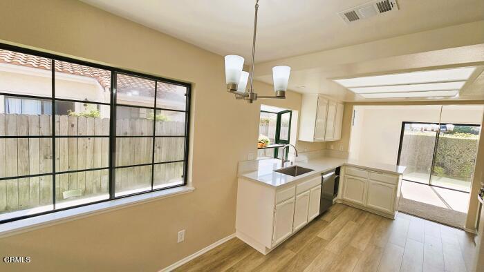 1161 Windward Way Oxnard, CA 93035 - Photo 3 of 19 a bathroom with a sink a tub and mirror