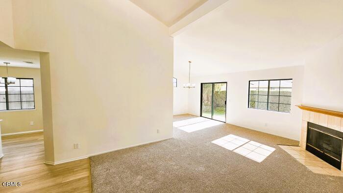 1161 Windward Way Oxnard, CA 93035 - Photo 5 of 19 a view of an empty room with wooden floor and a window