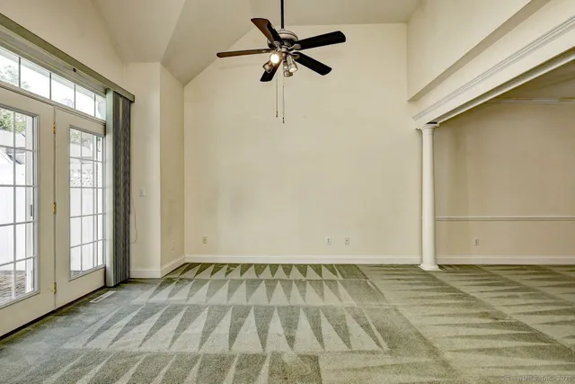 a view of an empty room with a window