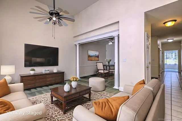 a living room with furniture and a flat screen tv