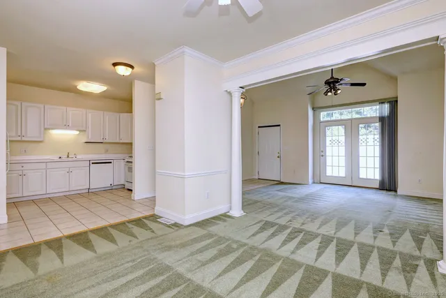 a view of a kitchen with kitchen island wooden floor and window