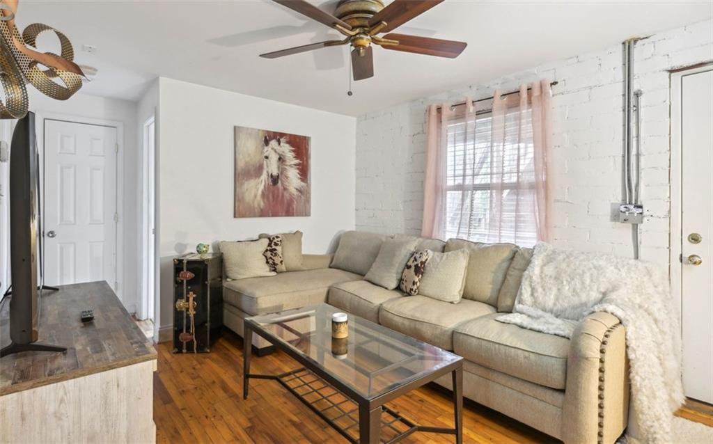 24 Daniel Street Southeast, Unit 6 Atlanta, GA 30312 - Photo 2 of 14 a living room with furniture and a window