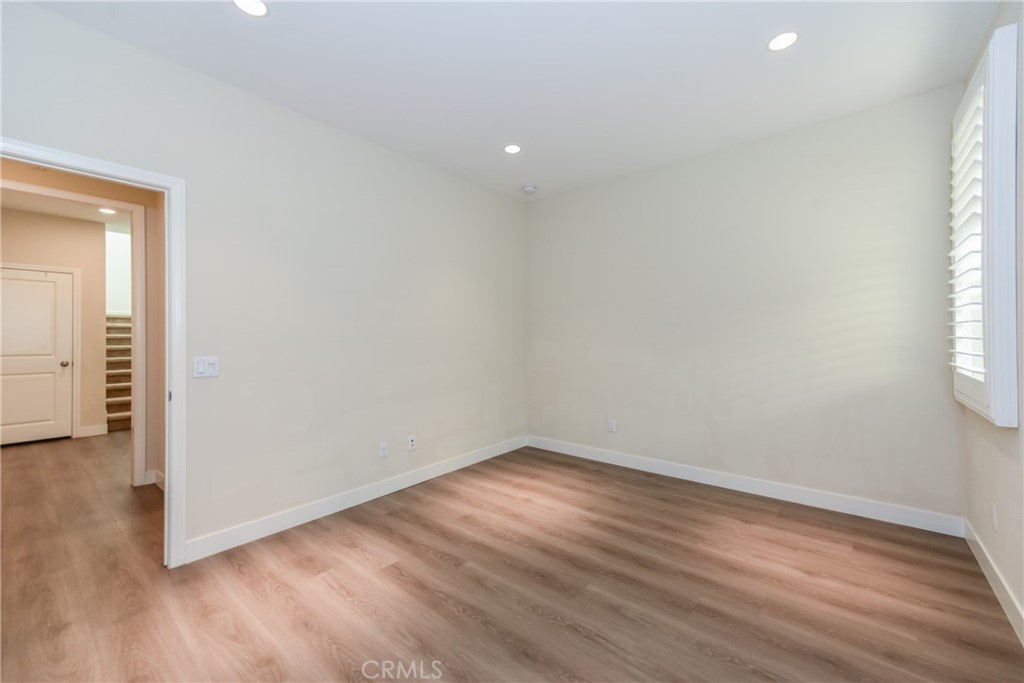 67 Elmdale Irvine, CA 92620 - Photo 13 of 39 a view of a room with wooden floor and a window