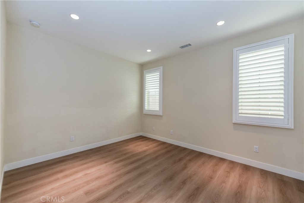 67 Elmdale Irvine, CA 92620 - Photo 14 of 39 wooden floor in an empty room with a window