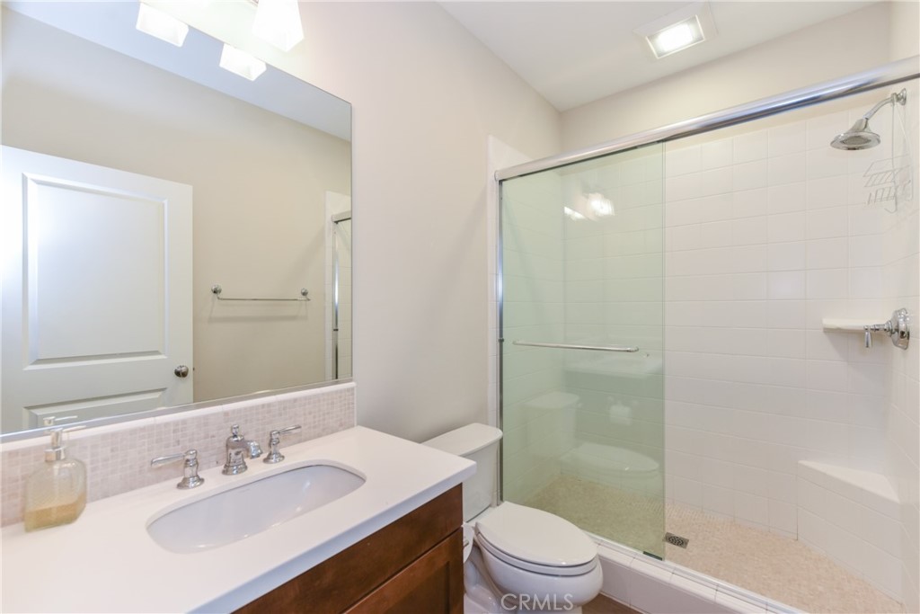 67 Elmdale Irvine, CA 92620 - Photo 15 of 39 a bathroom with a sink a toilet and shower