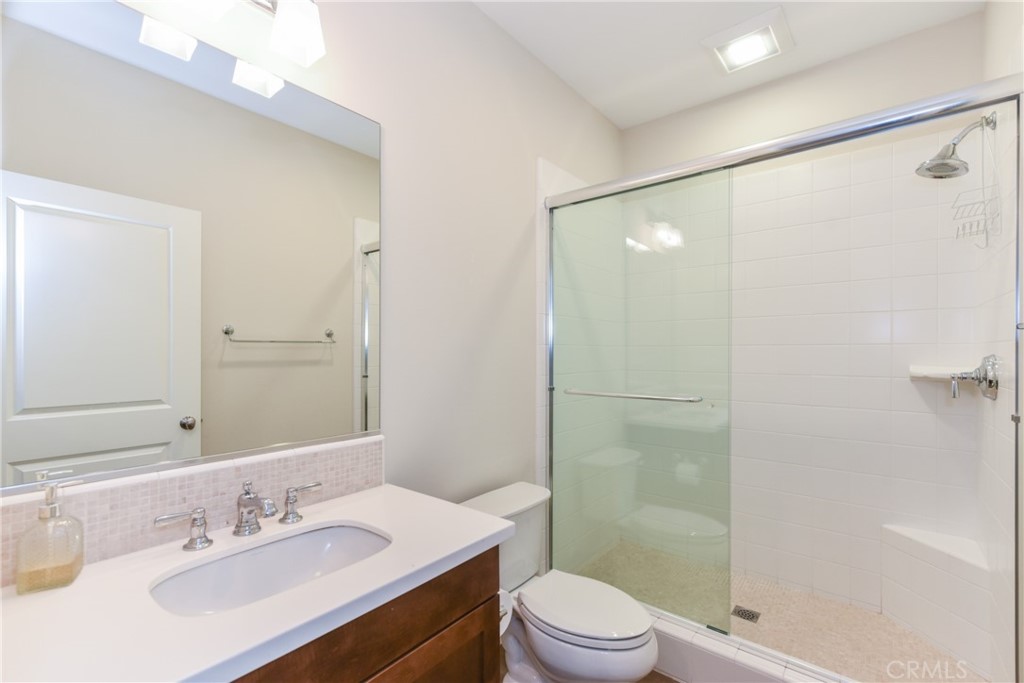 67 Elmdale Irvine, CA 92620 - Photo 16 of 39 a bathroom with a sink a toilet and shower