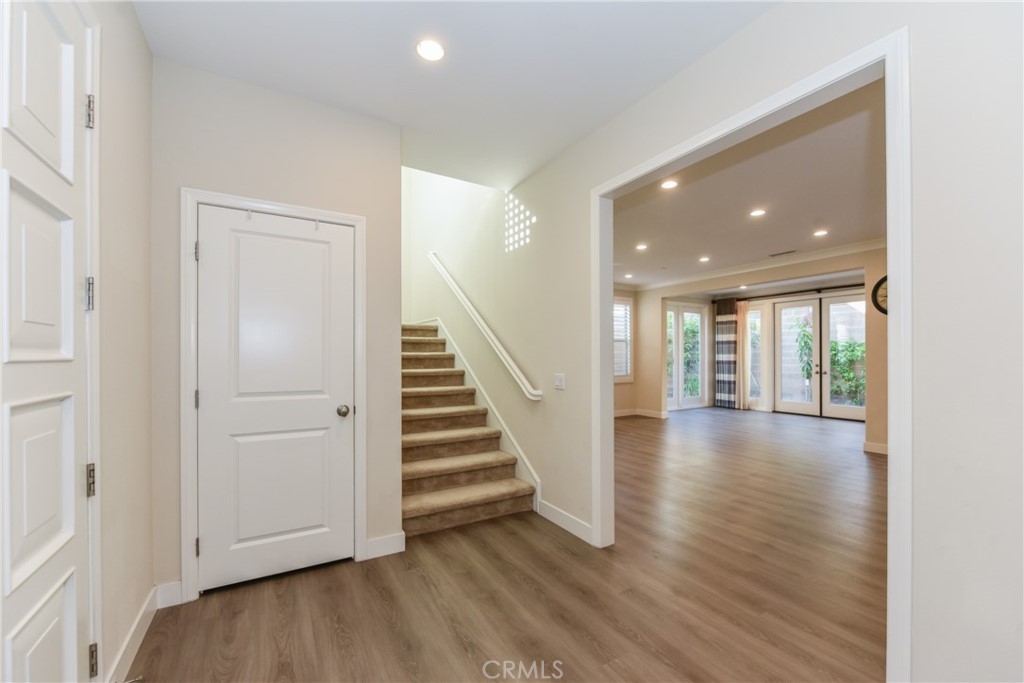 67 Elmdale Irvine, CA 92620 - Photo 17 of 39 a view of a room with wooden floor and entryway