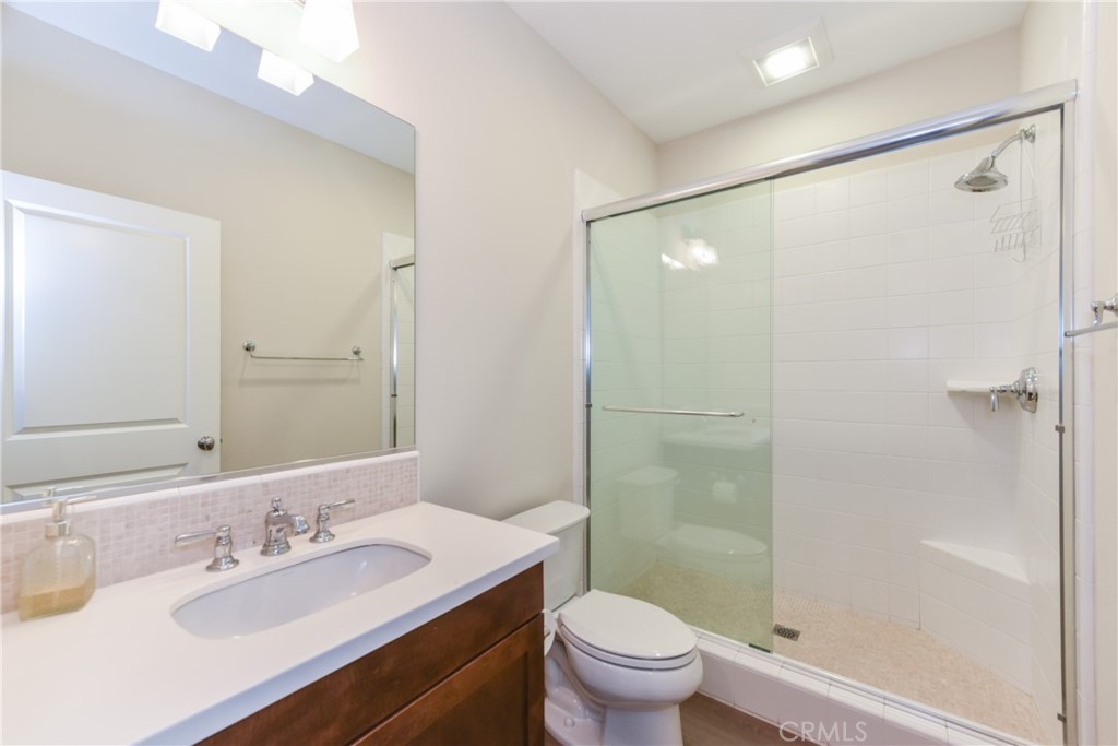 67 Elmdale Irvine, CA 92620 - Photo 19 of 39 a bathroom with a sink a toilet and shower