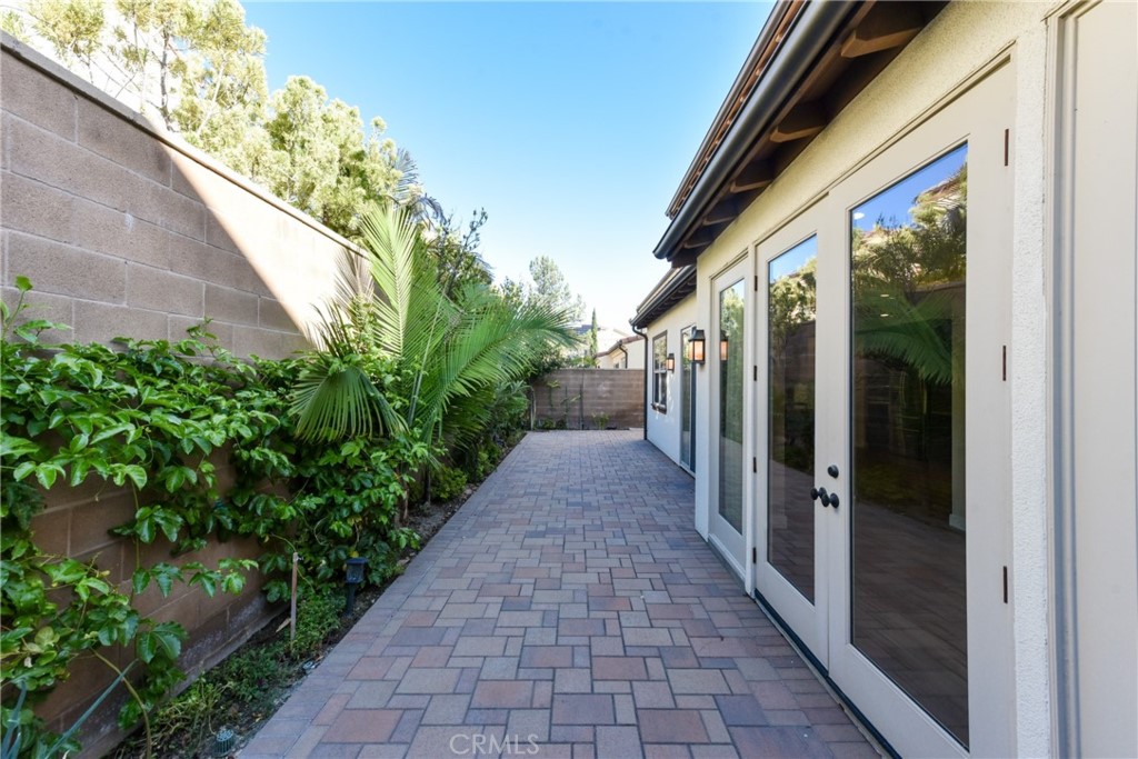 67 Elmdale Irvine, CA 92620 - Photo 33 of 39 a view of a pathway both side of house