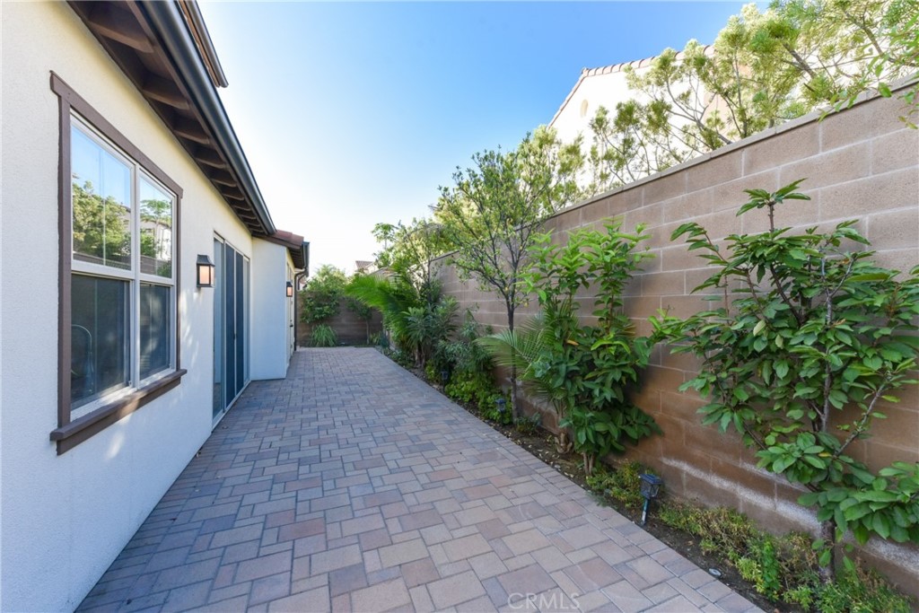 67 Elmdale Irvine, CA 92620 - Photo 35 of 39 a view of a pathway both side of house