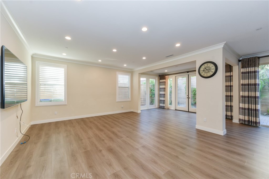 67 Elmdale Irvine, CA 92620 - Photo 4 of 39 a view of an empty room with wooden floor and a window