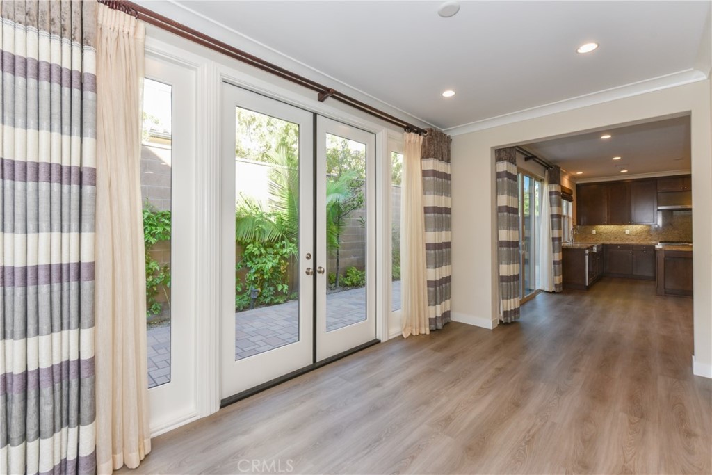 67 Elmdale Irvine, CA 92620 - Photo 8 of 39 a view of an empty room with wooden floor and a window