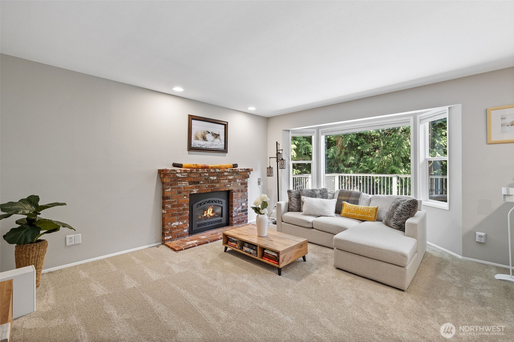 4310 209th Avenue Northeast Sammamish, WA 98074 - Photo 16 of 39 a living room with furniture and a fireplace