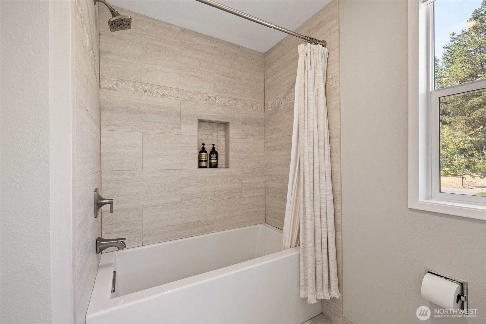 4310 209th Avenue Northeast Sammamish, WA 98074 - Photo 26 of 39 a bathroom with a bathtub