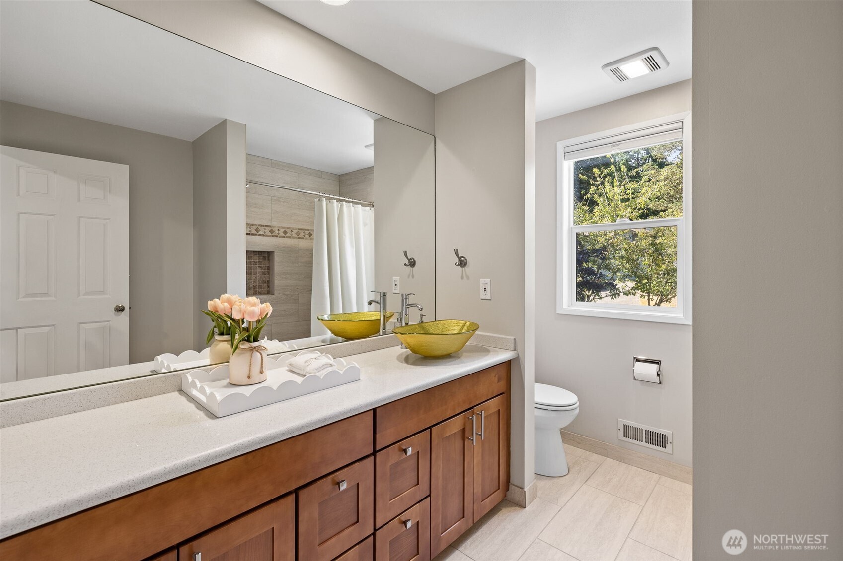 4310 209th Avenue Northeast Sammamish, WA 98074 - Photo 29 of 39 a bathroom with a granite countertop sink and a mirror
