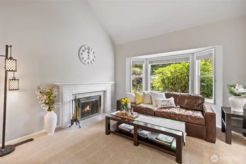 a kitchen with white cabinets and appliances