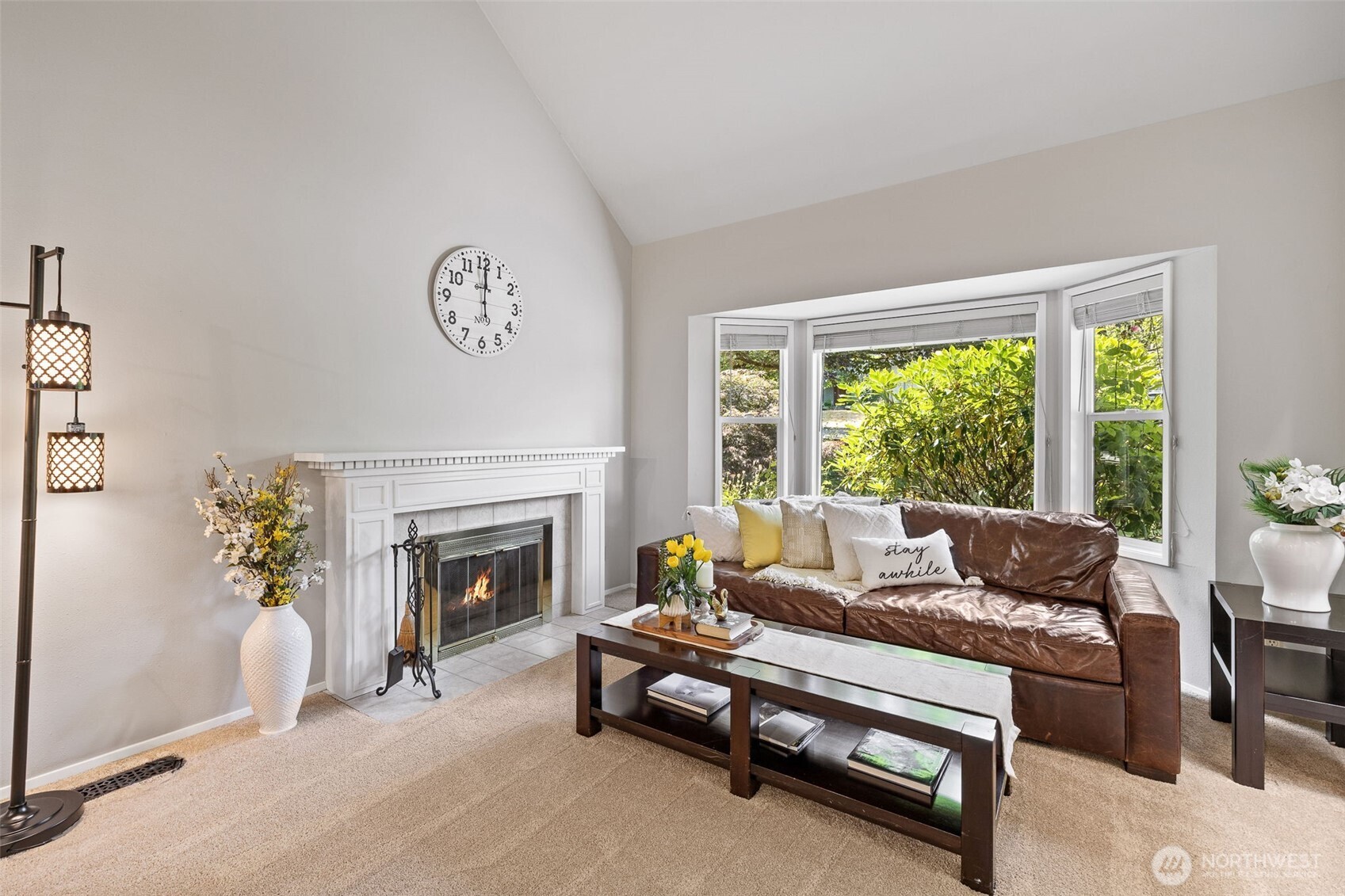 4310 209th Avenue Northeast Sammamish, WA 98074 - Photo 8 of 39 a living room with furniture and a fireplace