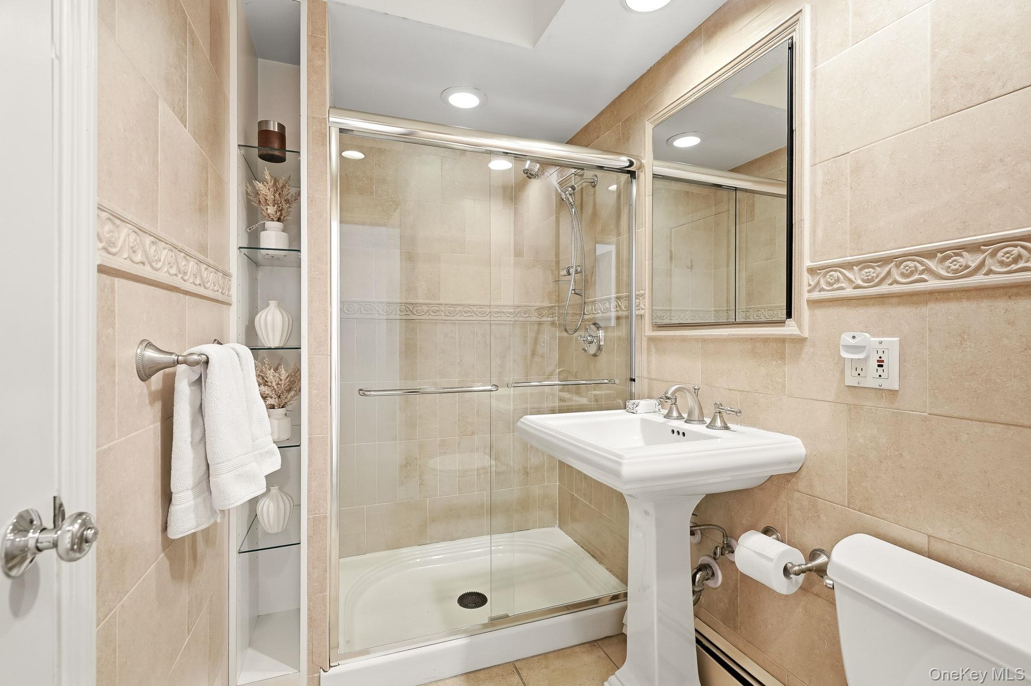 39 Lambert Lane New Rochelle, NY 10804 - Photo 15 of 36 First floor full bath with en suite to bedroom
