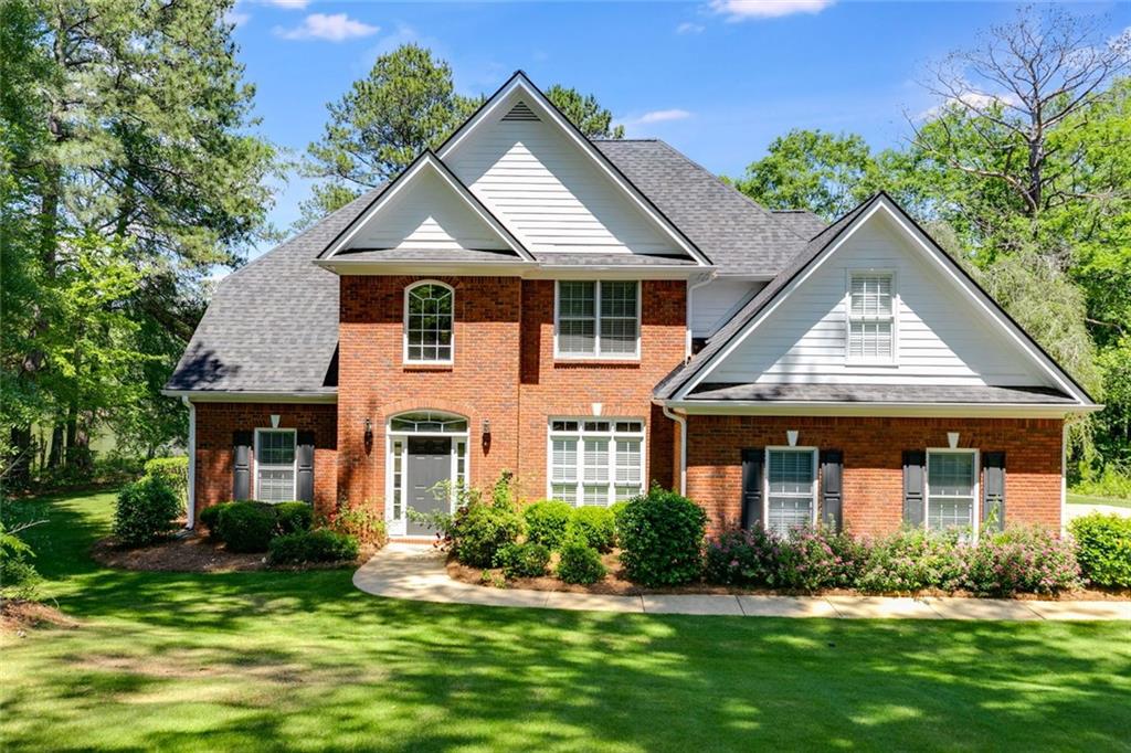 110 Pond View Point LaGrange, GA 30240 - Photo 1 of 68 a front view of a house with a yard and potted plants