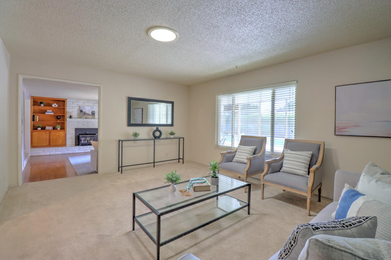 6265 North Colonial Avenue Fresno, CA 93704 - Photo 4 of 22 a living room with furniture and a flat screen tv