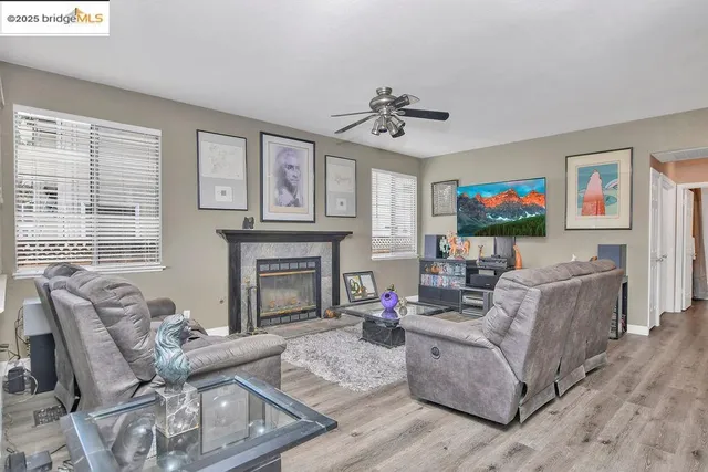 a view hallway with wooden floor and staircase