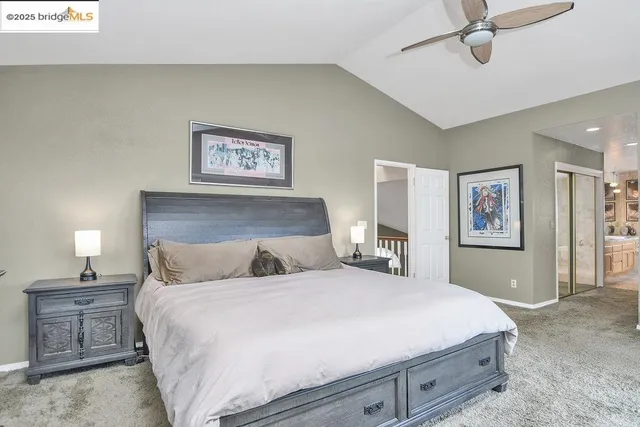 a bathroom with a granite countertop tub sink and mirror