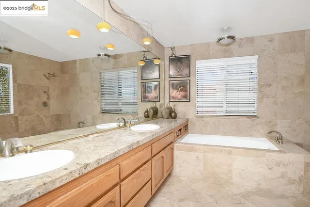 a bathroom with a bathtub and shower