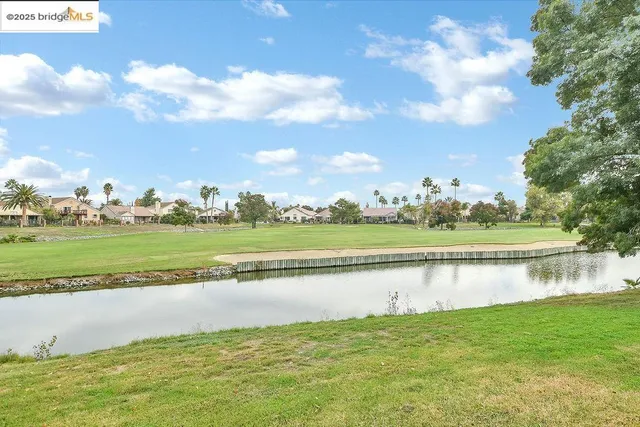 a view of a house with a yard porch and furniture