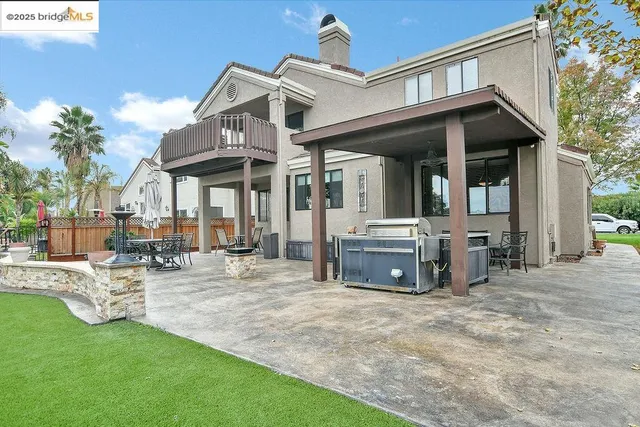 a view of a patio with a table chairs and a porch