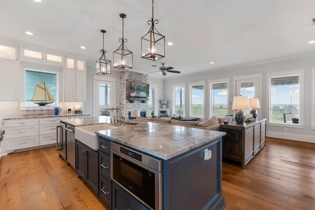 a kitchen with stainless steel appliances granite countertop a stove and a sink