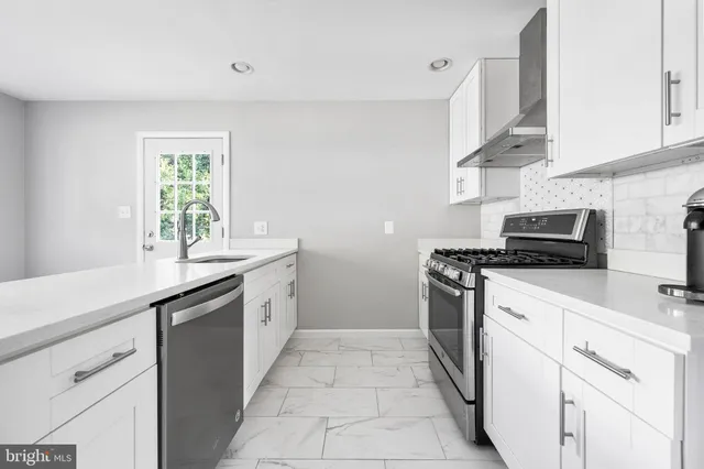a kitchen with a sink and a stove