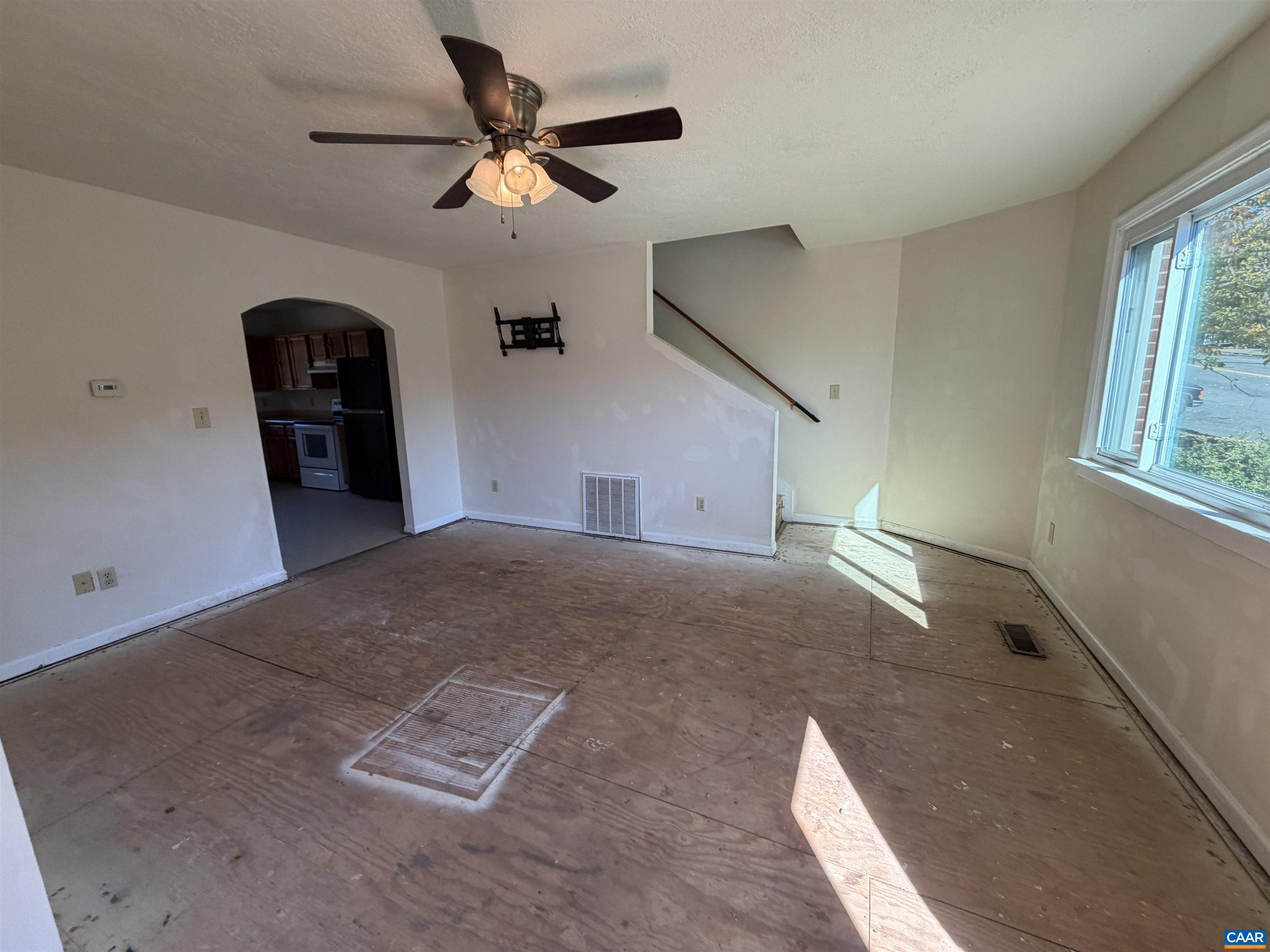 1453 Avon Street Charlottesville, VA 22902 - Photo 3 of 13 a view of a livingroom with a ceiling fan and window