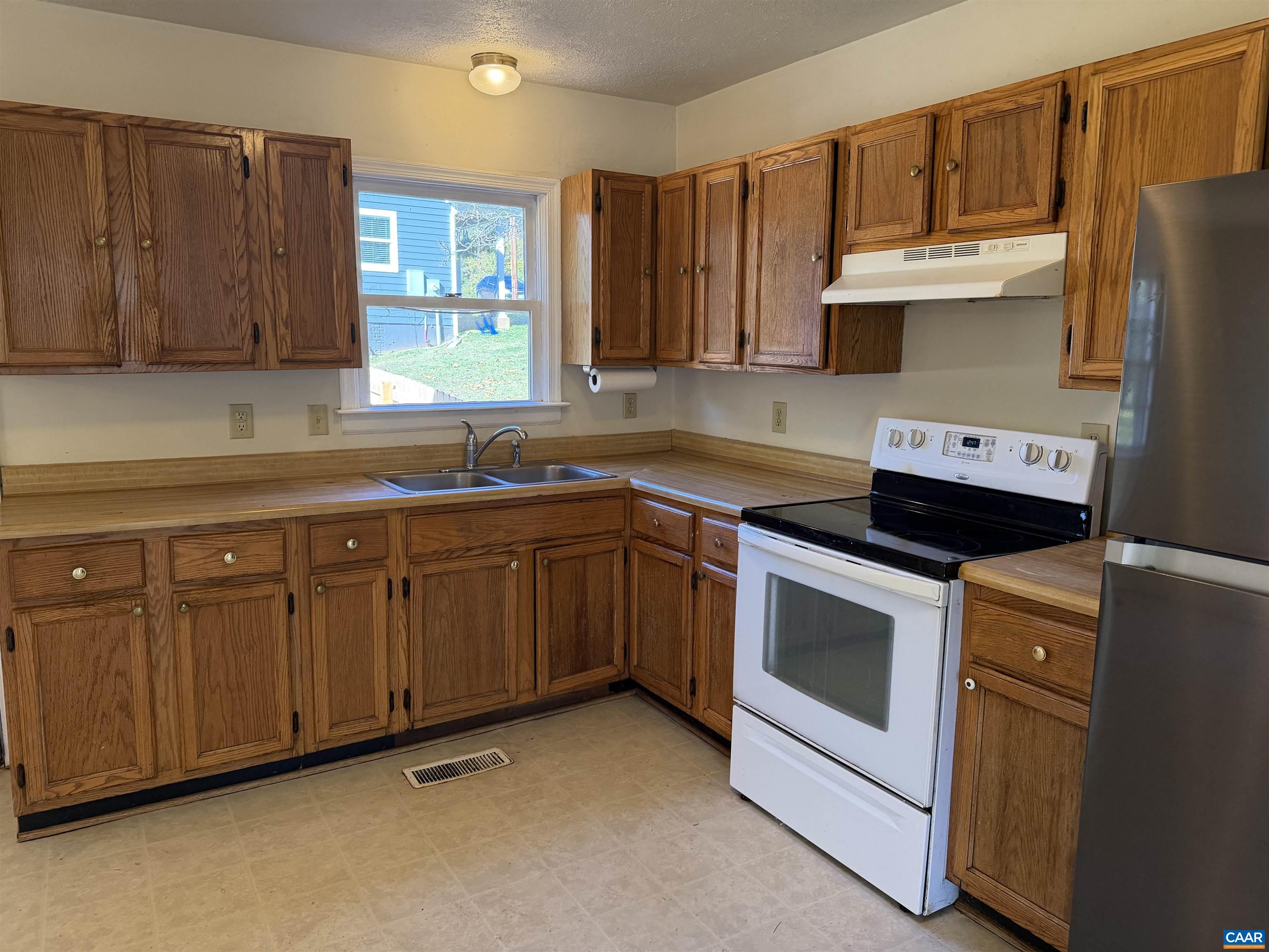 1453 Avon Street Charlottesville, VA 22902 - Photo 4 of 13 a kitchen with cabinets appliances and a sink