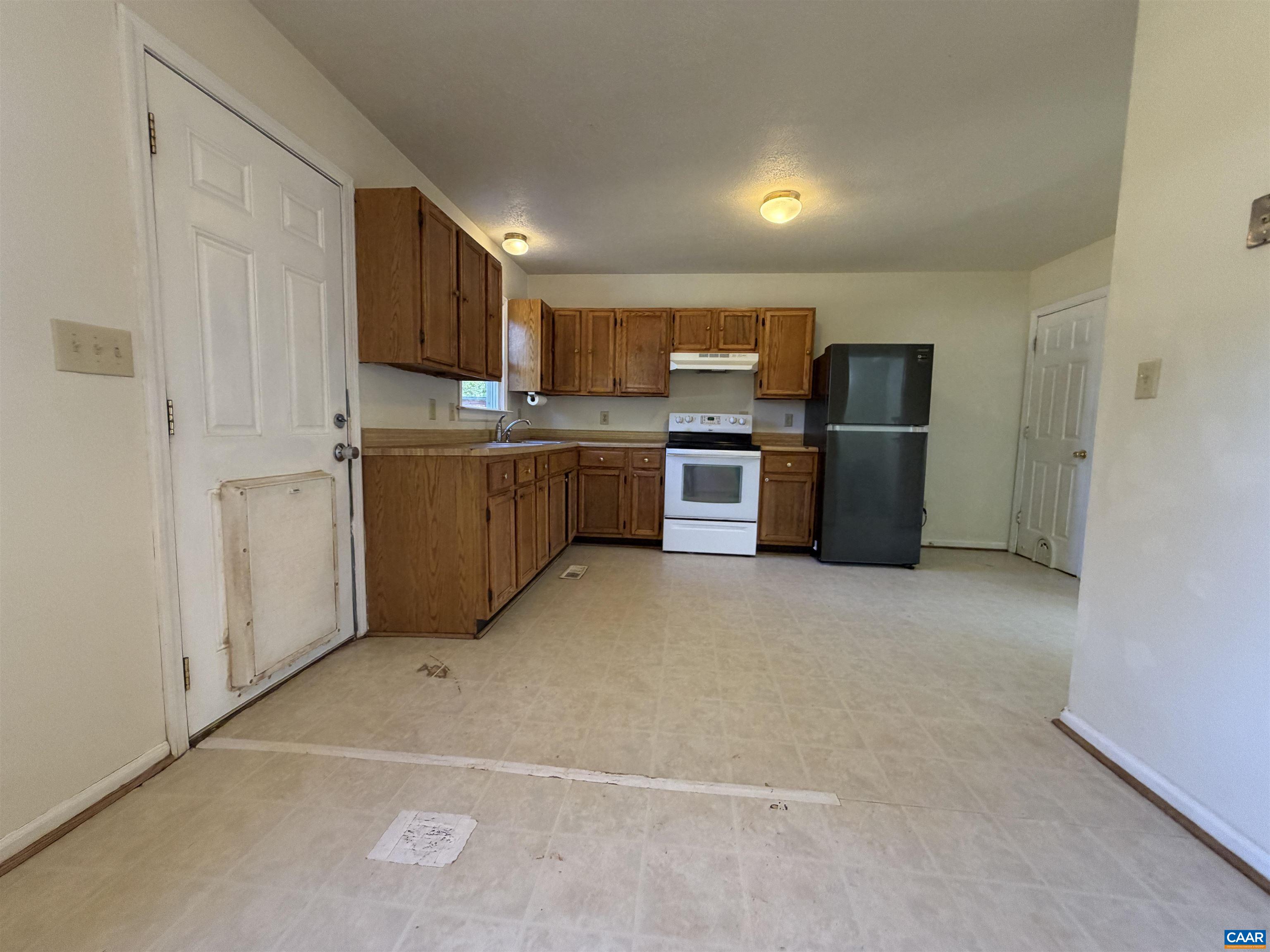 1453 Avon Street Charlottesville, VA 22902 - Photo 6 of 13 a kitchen with stainless steel appliances a refrigerator and a stove