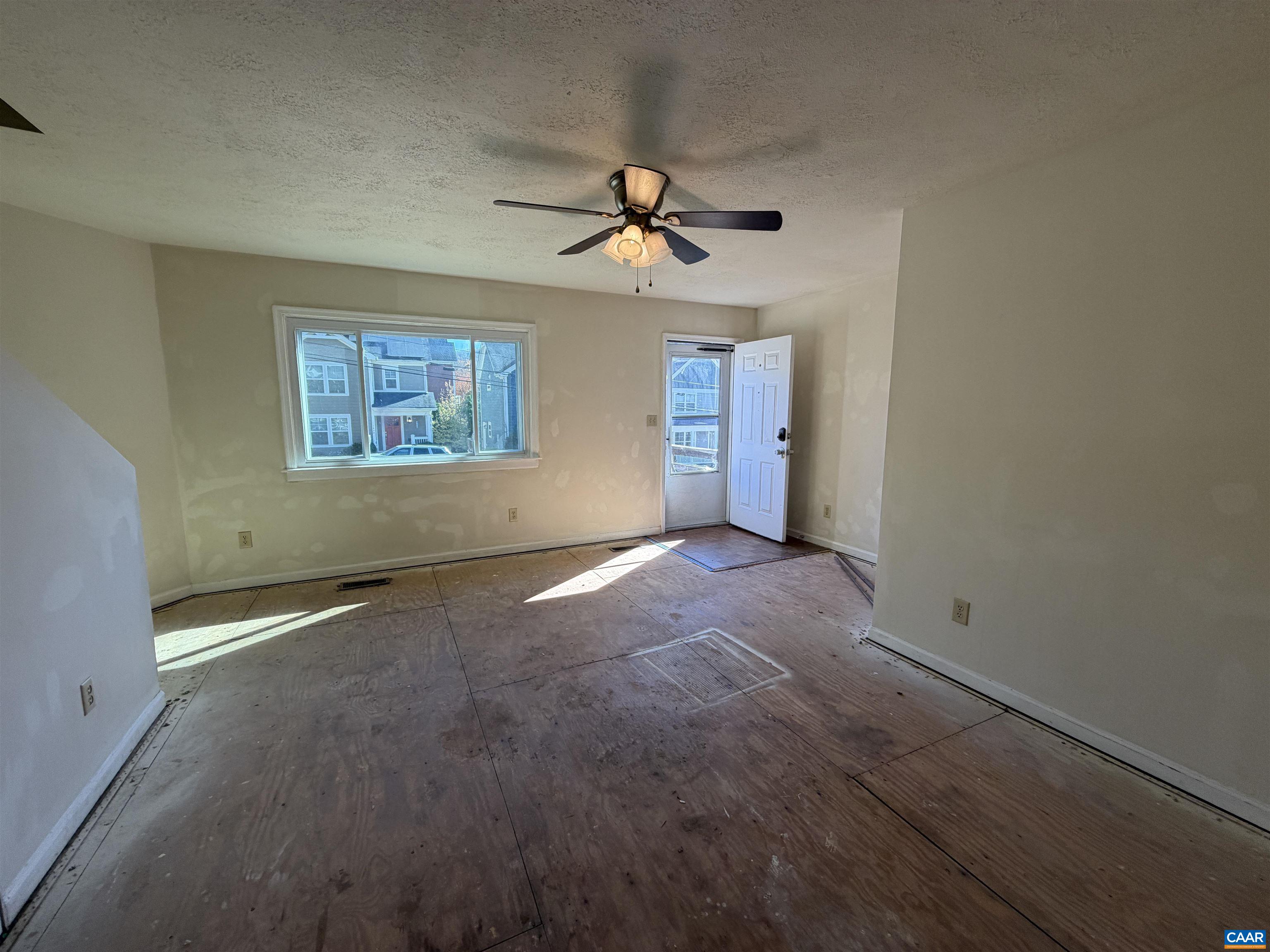 1453 Avon Street Charlottesville, VA 22902 - Photo 9 of 13 an empty room with windows and fan